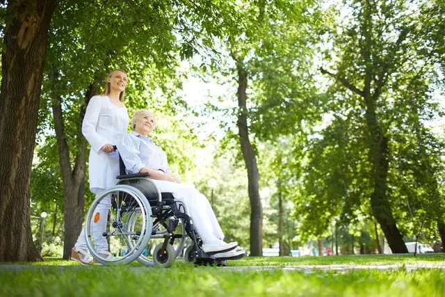 Caregiver Nurse Walking With Senior Patient 640