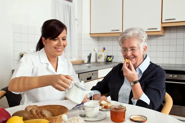 Nurse Helps Elderly Woman 640