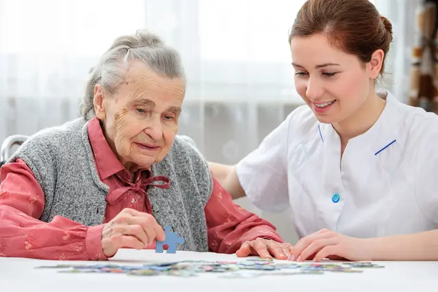 Senior Woman With Her Caregiver 640